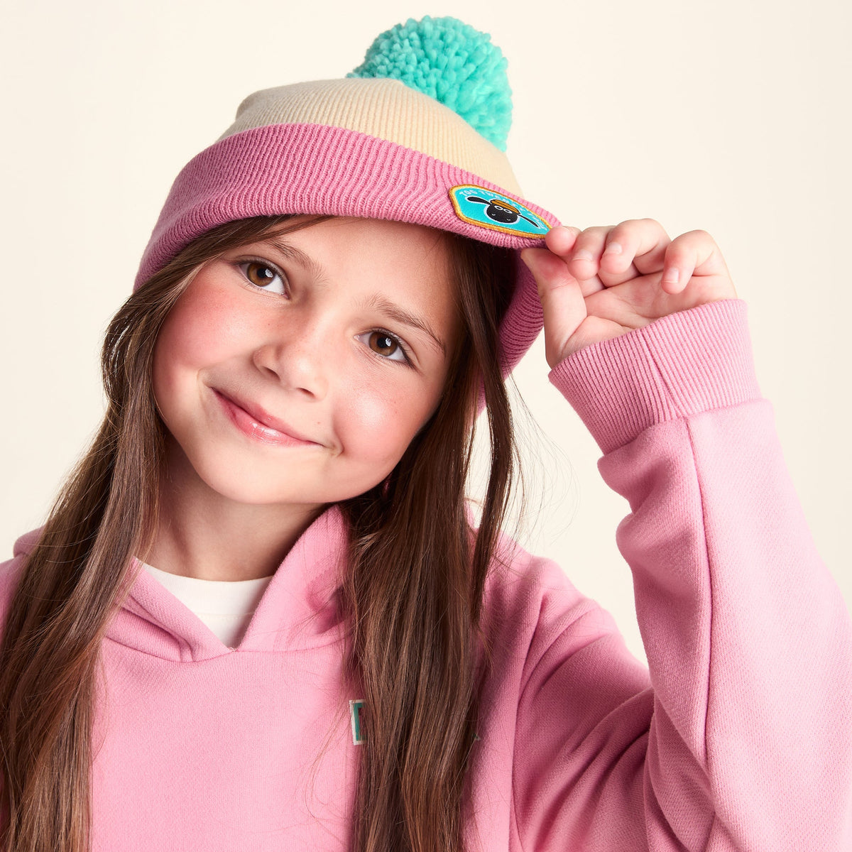 Beulah Shaun the Sheep Kids Knitted Beanie Pom Pom Hat - Woolly/Candyfloss - Image 2